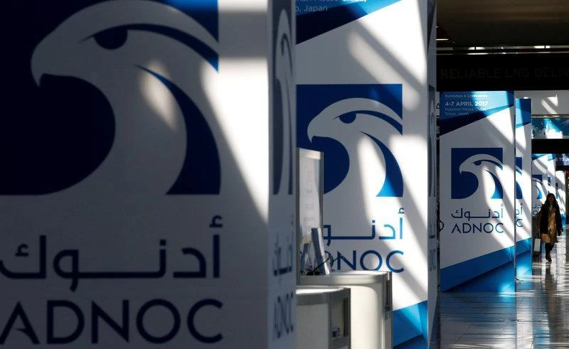 ADNOC logos seen at Gastech, the world’s biggest expo for the gas industry, in Chiba, Japan, on April 4. (Reuters)