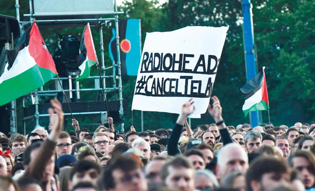 Pro-Palestine supporters protest in Glasgow on July 7 against Radiohead’s planned concert in Tel Aviv. (AFP)