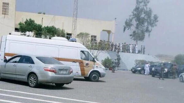 This file photo shows security forces gathered outside the Special Emergency Forces Mosque in Asir province minutes after it was hit by a suicide bomber in August 2015.