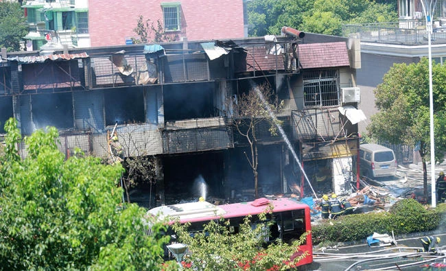 Firefighters work at the site of an explosion at a restaurant in Hangzhou, Zhejiang province, China on Friday. (REUTERS)