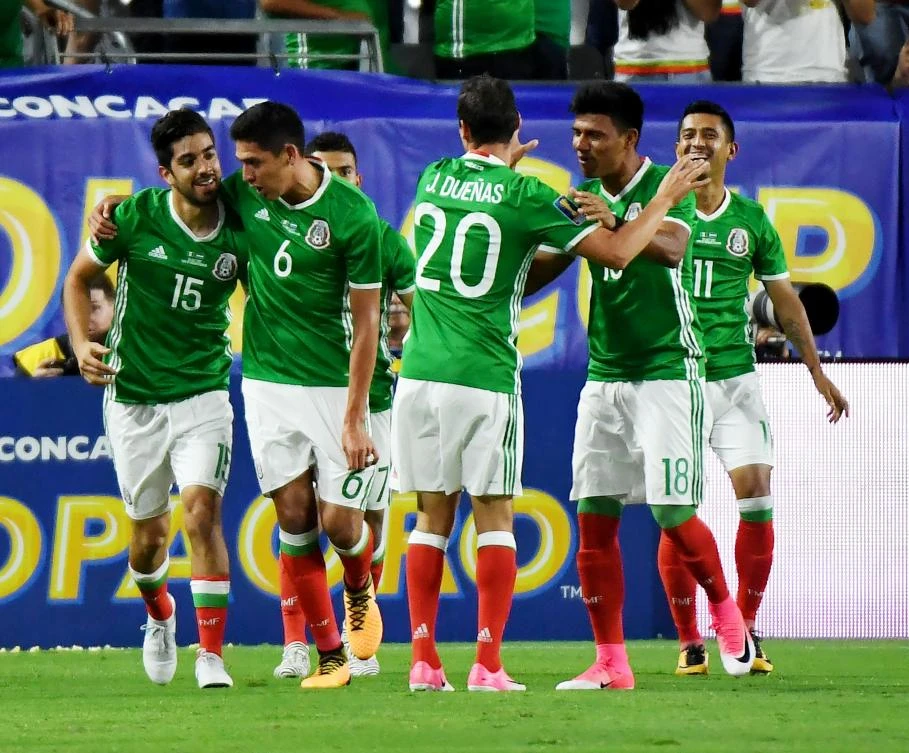 Mexico’s Rodolfo Pizarro (L) celebrates with teammates after scoring against Honduras in their quarter final game during the 2017 CONCACAF Gold Cup at the University of Phoenix Stadium on July 20, 2017 in Glendale, Arizona. (AFP)