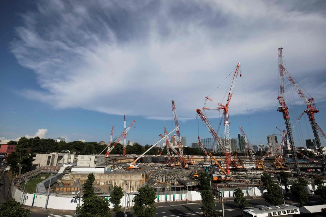 This picture shows a general view of the construction site for the National Stadium, venue for the upcoming Tokyo 2020 Olympic Games, in Tokyo on July 21, 2017. The suicide of a 23-year-old worker on Tokyo's Olympic stadium was due to overwork, his family said on July 21, as Japan races to finish building venues for the 2020 Games. (AFP)