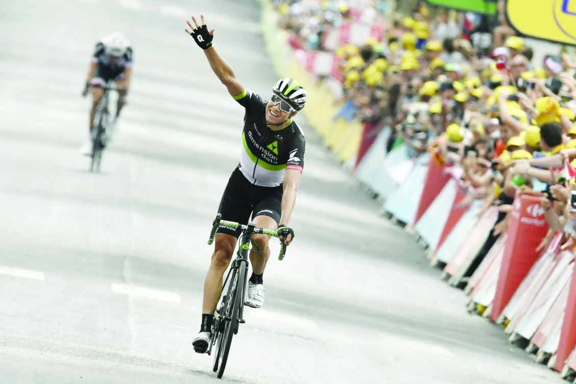 Edvald Boasson Hagen celebrates as he crosses the finish line at the end of the 19th stage of the 104th edition of the Tour de France cycling race on Friday. (AFP)