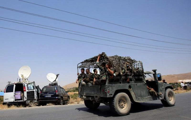 Lebanese army soldiers are seen inside a military vehicle in Labwe, at the entrance of the border town of Arsal, in eastern Bekaa Valley, Lebanon July 21, 2017. (REUTERS)
