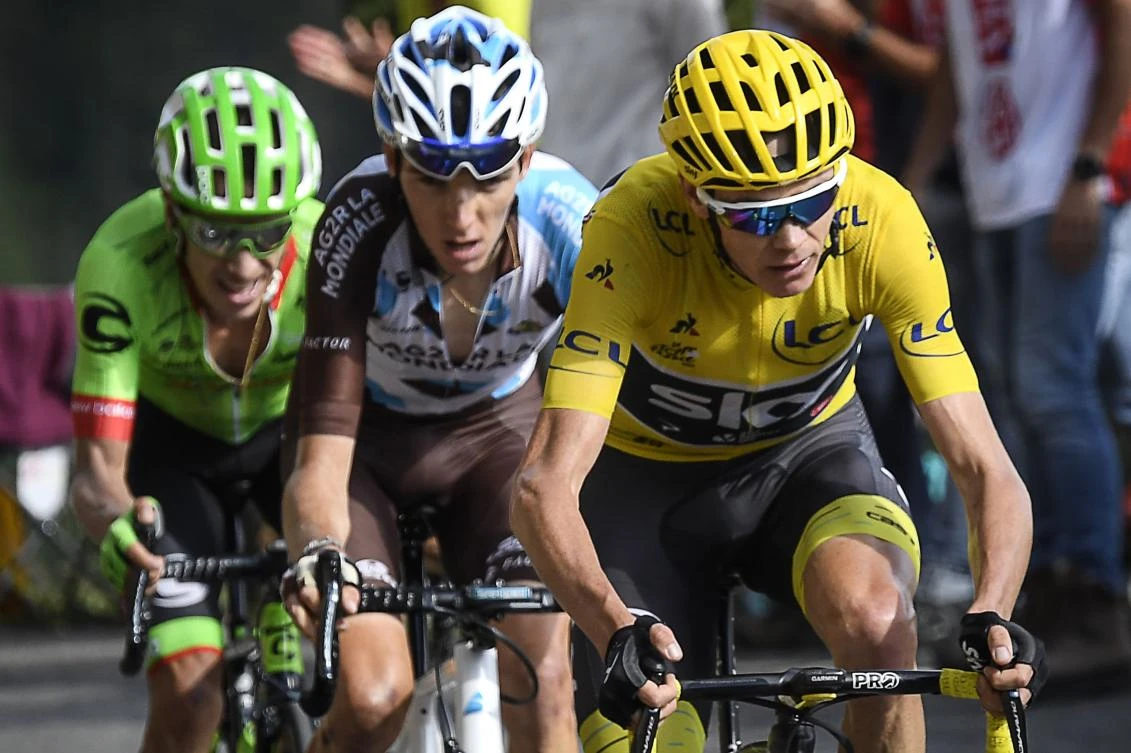 (From R) Great Britain's Christopher Froome, wearing the overall leader's yellow jersey, France's Romain Bardet and Colombia's Rigoberto Uran climb the Col d'Izoard during the 179,5 km eighteenth stage of the 104th edition of the Tour de France cycling race on July 20, 2017 between Briancon and Izoard, French Alps. (AFP)