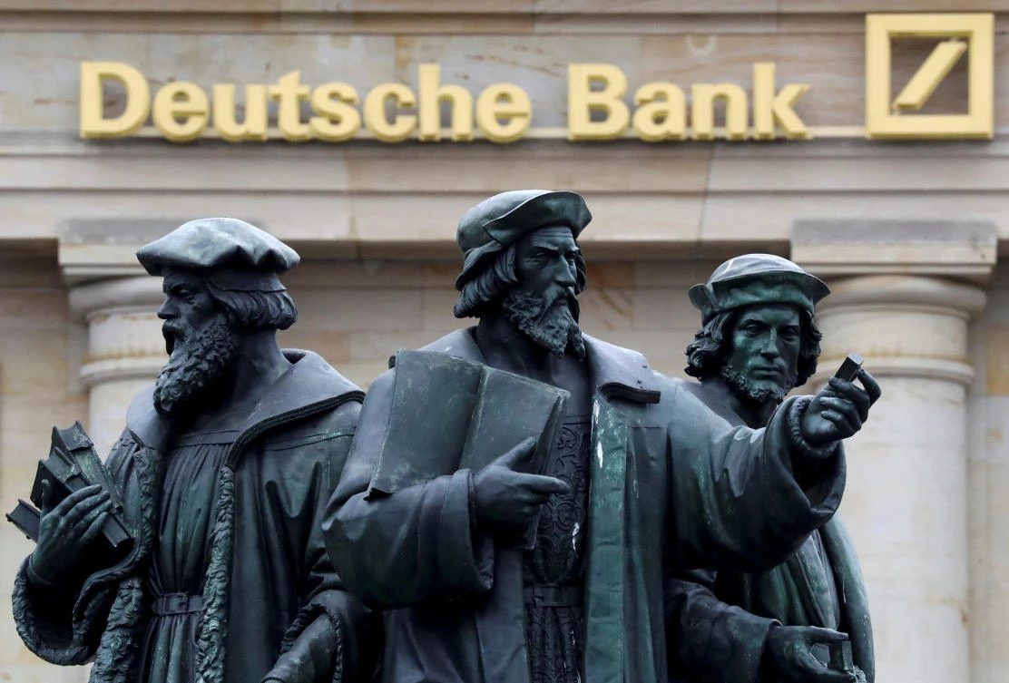 A statue is pictured next to the logo of Germany’s Deutsche Bank in Frankfurt, Germany, )September 30, 2016. (REUTERS file Photo