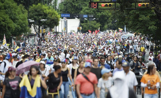 Opposition activists take part in a march toward the Supreme Court of Justice in Caracas in an offensive against President Nicolas Maduro on Saturday. (AFP)