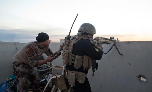 In this file photo, an Iraqi special forces soldier fires his weapon, on the eastern edge of Mosul, Iraq. (AP)