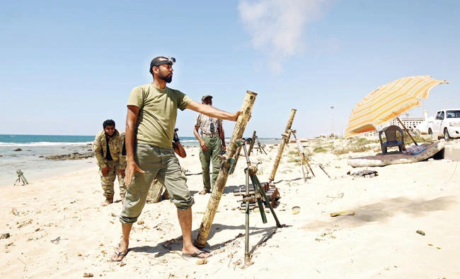 Troops loyal to Libyan strongman Khalifa Haftar fire mortar shells at militants in Benghazi in this file photo. (AFP)