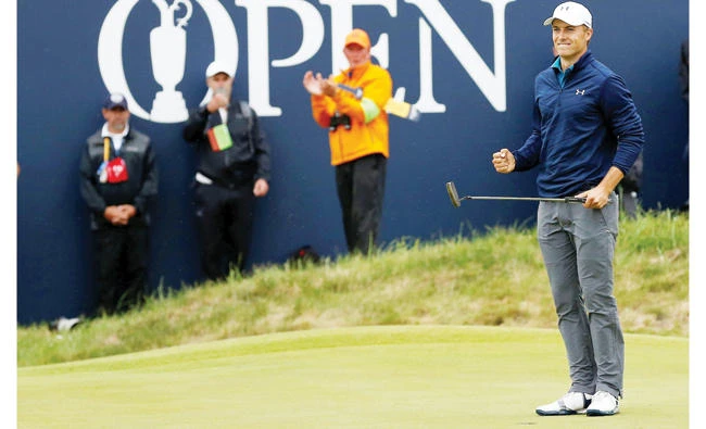 Jordan Spieth celebrates after holing a putt on the 18th green to win The Open Championship on Sunday. (Reuters)