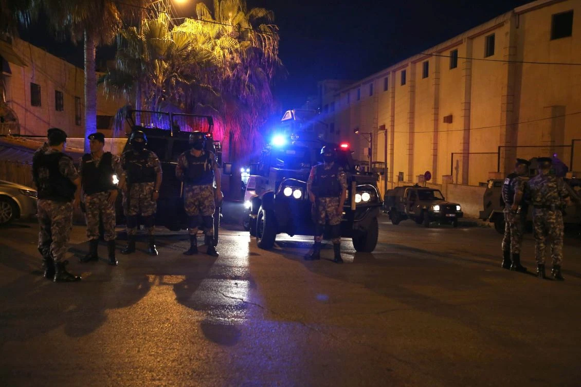 Security forces stand outside the Israeli embassy in the residential Rabiyeh neighborhood of the Jordanian capital Amman following a shooting "incident". (AFP / Khalil Mazraawi)
