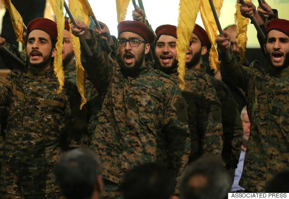 FILE - Hezbollah members saluting. (AP)