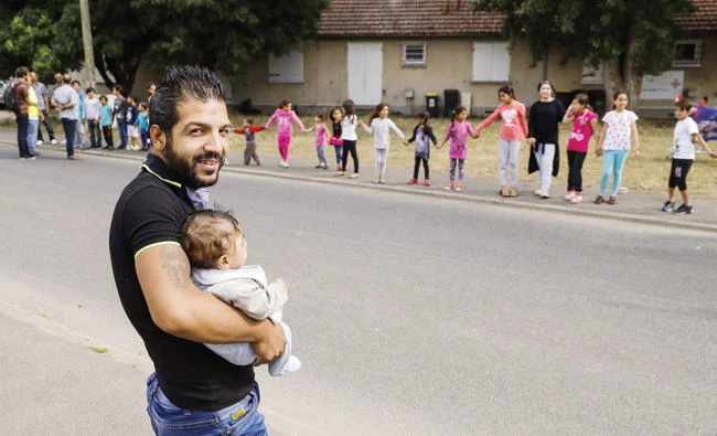 Migrants protest a pending eviction from a former housing estate in Athis-Mons, France, on July 20. (AFP)