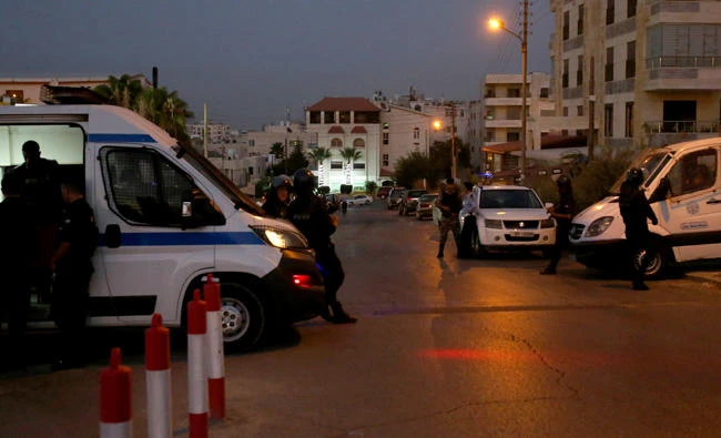 Jordanian security forces stand guard outside the Israeli embassy in the residential Rabiyeh neighbourhood of the capital Amman following an 'incident' on July 23, 2017. A Jordanian was killed and an Israeli seriously wounded at the Jewish state's embassy in Amman, a security source said. (AFP)