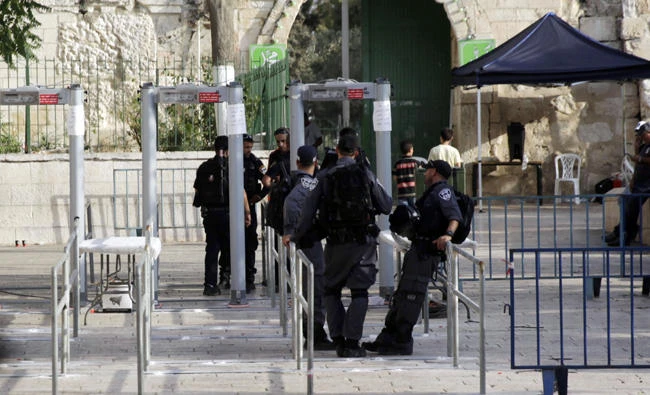 Israeli police officers are seen outside the Al Aqsa Mosque compound in Jerusalem's Old City on Monday. (AP Photo/Mahmoud Illean)