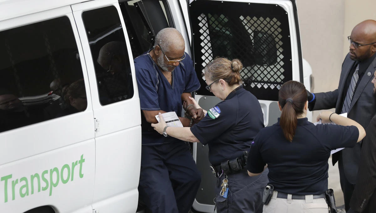 James Mathew Bradley Jr., 60, of Clearwater, Fla., left, arrives at the federal courthouse for a hearing, Monday, July 24, 2017, in San Antonio. Bradley was taken into custody and is expected to be charged in connection to the people who died after being crammed into a sweltering tractor-trailer found parked outside a Walmart in the midsummer Texas heat Sunday, according to authorities in what they described as an immigrant-smuggling attempt gone wrong. (AP)