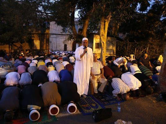 Palestinian Muslim worshippers gather to pray outside Jerusalem's Old City on July 25, 2017 as Muslim officials said worshippers should continue to boycott the Al-Aqsa mosque compound, even after Israel removed newly installed security measures that had triggered deadly violence. Israel removed metal detectors from a highly sensitive Jerusalem holy site after their installation triggered deadly violence, but Muslim officials said worshippers should continue a boycott for now. Israel installed metal detectors at entrances to the compound after an attack nearby that killed two policemen on July 14.
(AFP)