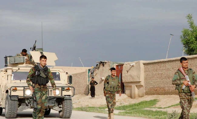 Afghan soldiers arrive near the site of an ongoing attack on an army headquarters in northern Afghanistan where Taliban attacked a military base, in this file photo. (Reuters)