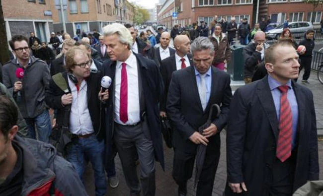 The leader of the Dutch far-right Party for Freedom Geert Wilders speaks to the press during his visit to the Schilderswijk district in The Hague in this file photo. The Netherlands' highest court ordered the Dutch government to approve funding for a new Islamic school in Amsterdam which it had sought to ban. (AFP file photo).