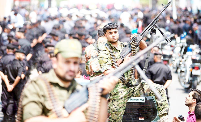 Members of Palestinian forces loyal to Hamas take part in a military parade in Gaza City on Wednesday. (AFP)