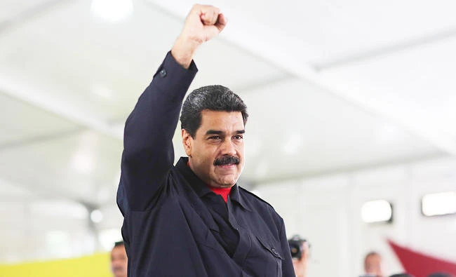 Venezuela's President Nicolas Maduro gestures during a meeting with supporters in Caracas, Venezuela on Wednesday. (REUTERS)
