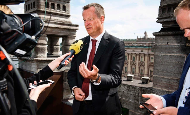 Sweden's Minister for Home Affairs Anders Ygeman comments his resignation during an interview with TT News Agency in Stockholm, Sweden, on Thursday. Two Swedish ministers will leave the government in a reshuffle sparked by a huge leak of sensitive data, Prime Minister Stefan Lofven said. (AFP)