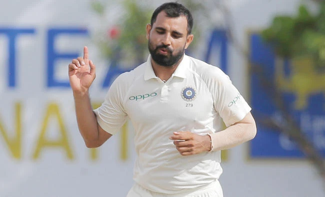 India’s Mohammed Shami, left, celebrates the dismissal of Sri Lanka’s Ajantha Mendis during the second day’s play of the first Test cricket match between India and Sri Lanka on Thursday. (AP)