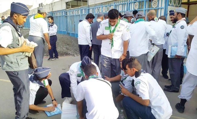 A group of scouts preparing a roadmap to assist and facilitate Haj pilgrims in Makkah. (SPA)