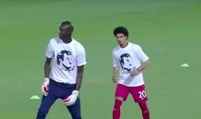 Qatari players displayed T-shirts of the country’s Emir before a recent World Cup qualifier. (YouTube)