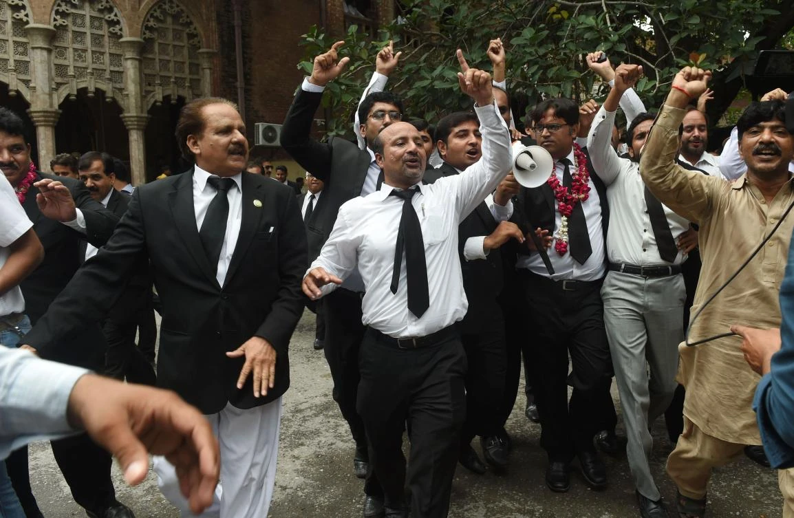 Pakistani lawyers celebrate the Supreme Court decision against Prime Minister Nawaz Sharif, in Lahore. AFP