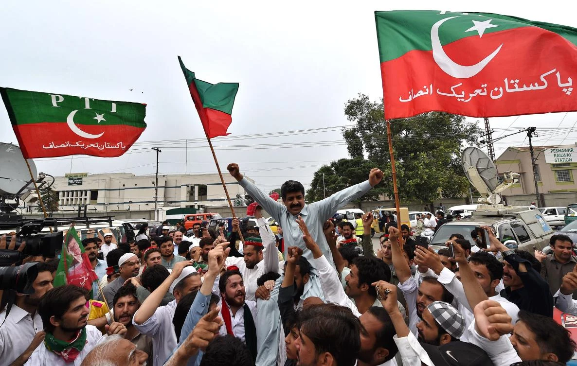 Activists in Peshawar gather to celebrate the Supreme Court decision against Prime Minister Nawaz Sharif. AFP