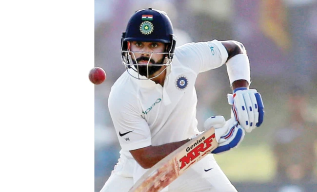 Virat Kohli plays a shot during a Test match between India and Sri Lanka in Galle on Friday. (Reuters)