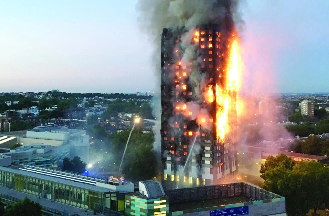 The file photo shows flames and smoke billowing from Grenfell Tower in West London. (AFP)