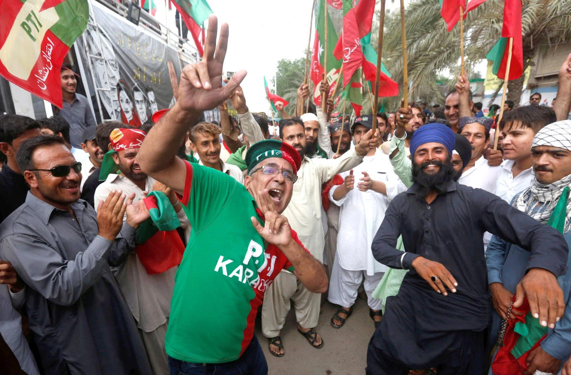 Opponents of Pakistan’s Prime Minister Nawaz Sharif react after the Supreme Court’s decision to disqualify Sharif, in Karachi, on Friday. (Reuters)
