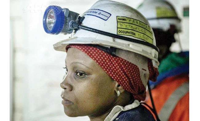 A woman miner works at the Rustenberg chrome mine in South Africa. (AFP)
