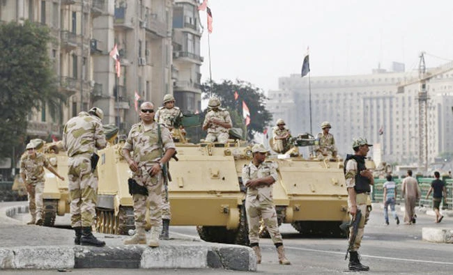 Egyptian soldiers stand alert at a roundabout in Cairo in this file photo. (AP)