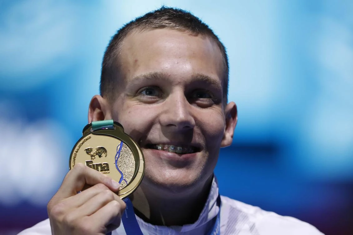 Caeleb Remel Dressel (gold) of the US poses with the medal on 27 July, 2017. (REUTERS)