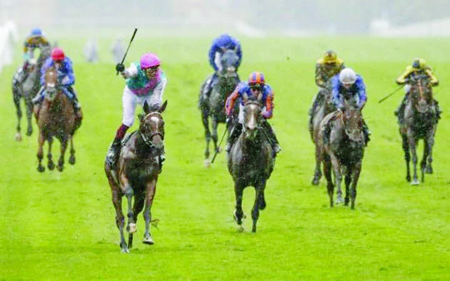 Frankie Dettori celebrates after guiding Enable to victory in the King George VI & Queen Elizabeth Stakes at Ascot on Saturday. (AFP)