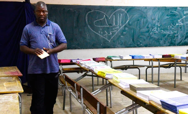 A man prepares to casting his vote in Senegal's legislative election in Dakar on Sunday. (AFP)