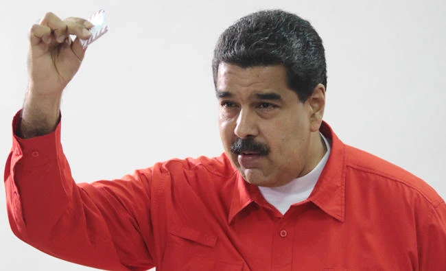 Venezuelan President Nicolas Maduro show his ballot as casts his vote at a polling station during the Constituent Assembly election in Caracas, Sunday. (Reuters)