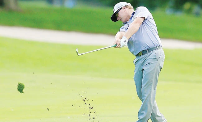 Charley Hoffman of the US plays his shot on the 18th hole during the third round of the RBC Canadian Open on Saturday. (AFP)