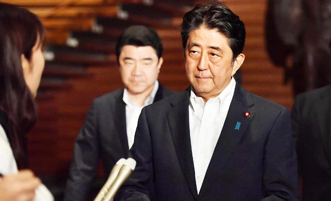 Japanese Prime Minister Shinzo Abe speaks to reporters about North Korea's missile launch at his official residence in Tokyo early on Saturday. (AP)