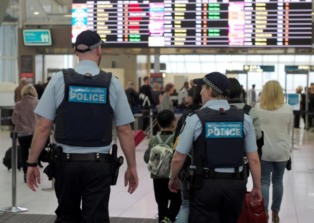 Australia Federal Police officers patrol the security lines at Sydney's Domestic Airport in Australia, July 31, 2017, following weekend raids related to a plot against Australia's aviation sector. (REUTERS)