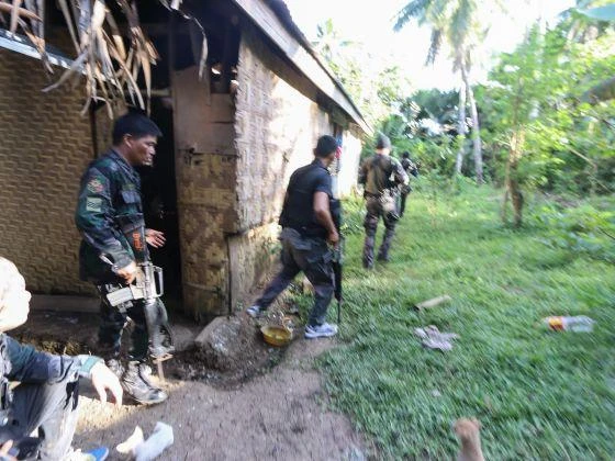Philippine military and police personnel are seen here moving into position in a battle with Abu Sayyaf members earlier this year. (AFP)