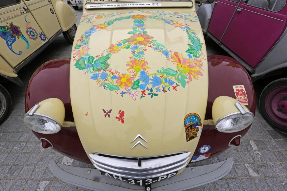 A car with a handicrafted painting is pictured in the parking area in Mafra after the parade of the World 2017 2CV Meeting July 30, 2017. The event is held between the 26th and the 31st of July 2017, 30 years after Portugal hosted the seventh 2CV World Meeting in 1987, and will include activities ranging from an open air fair, a competition to disassemble and reassemble, an "elegance" contest for original and modofied 2CV's, a chimes concert, to a short term 2CV museum hosted by the Marfa national palace featuring vehicles from the Citroen Heritage collection purposely brought from Paris. / AFP / JOSE MANUEL RIBEIRO