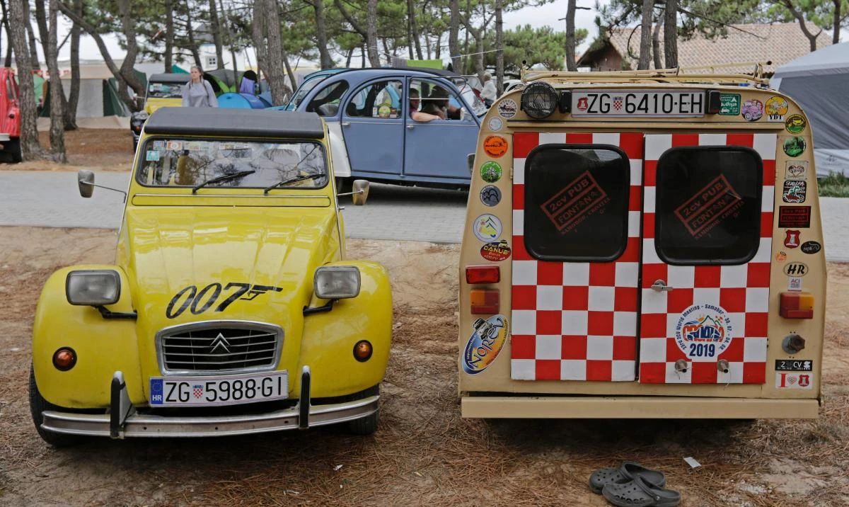 Cars are are parked at a camping site in Ericeira during the World 2017 2CV Meeting July 30, 2017. The event is held between the 26th and the 31st of July 2017, 30 years after Portugal hosted the seventh 2CV World Meeting in 1987, and will include activities ranging from an open air fair, a competition to disassemble and reassemble, an "elegance" contest for original and modofied 2CV's, a chimes concert, to a short term 2CV museum hosted by the Marfa national palace featuring vehicles from the Citroen Heritage collection purposely brought from Paris. / AFP / JOSE MANUEL RIBEIRO