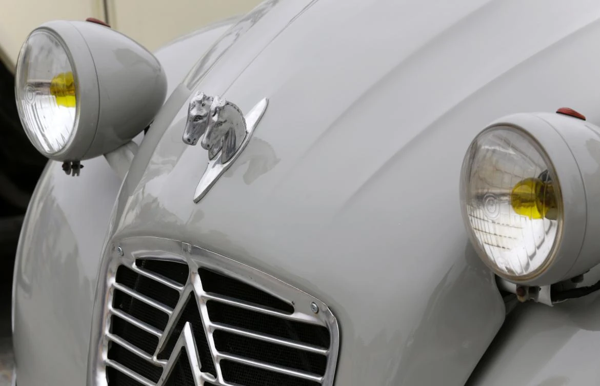 Details of a 2 CV are pictured at a camping site in Ericeira during the World 2017 2CV Meeting July 30, 2017. The event is held between the 26th and the 31st of July 2017, 30 years after Portugal hosted the seventh 2CV World Meeting in 1987, and will include activities ranging from an open air fair, a competition to disassemble and reassemble, an "elegance" contest for original and modofied 2CV's, a chimes concert, to a short term 2CV museum hosted by the Marfa national palace featuring vehicles from the Citroen Heritage collection purposely brought from Paris. / AFP / JOSE MANUEL RIBEIRO