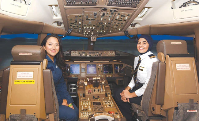 Shaesta Waiz and Bakhita Al-Muheiri at the state-of-the-art simulator
at Emirates Aviation College.