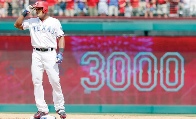 Texas Rangers’ Adrian Beltre tips his helmet as he acknowledges cheers after hitting a double for his 3,000th career hit that came off a pitch from Baltimore Orioles' Wade Miley in the fourth inning of a baseball game Sunday in Arlington, Texas. (AP)