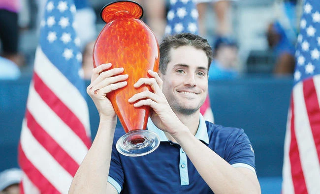 John Isner poses with the trophy after defeating Ryan Harrison in the finals of the Atlanta Open tennis tournament Sunday in Atlanta. (AP)